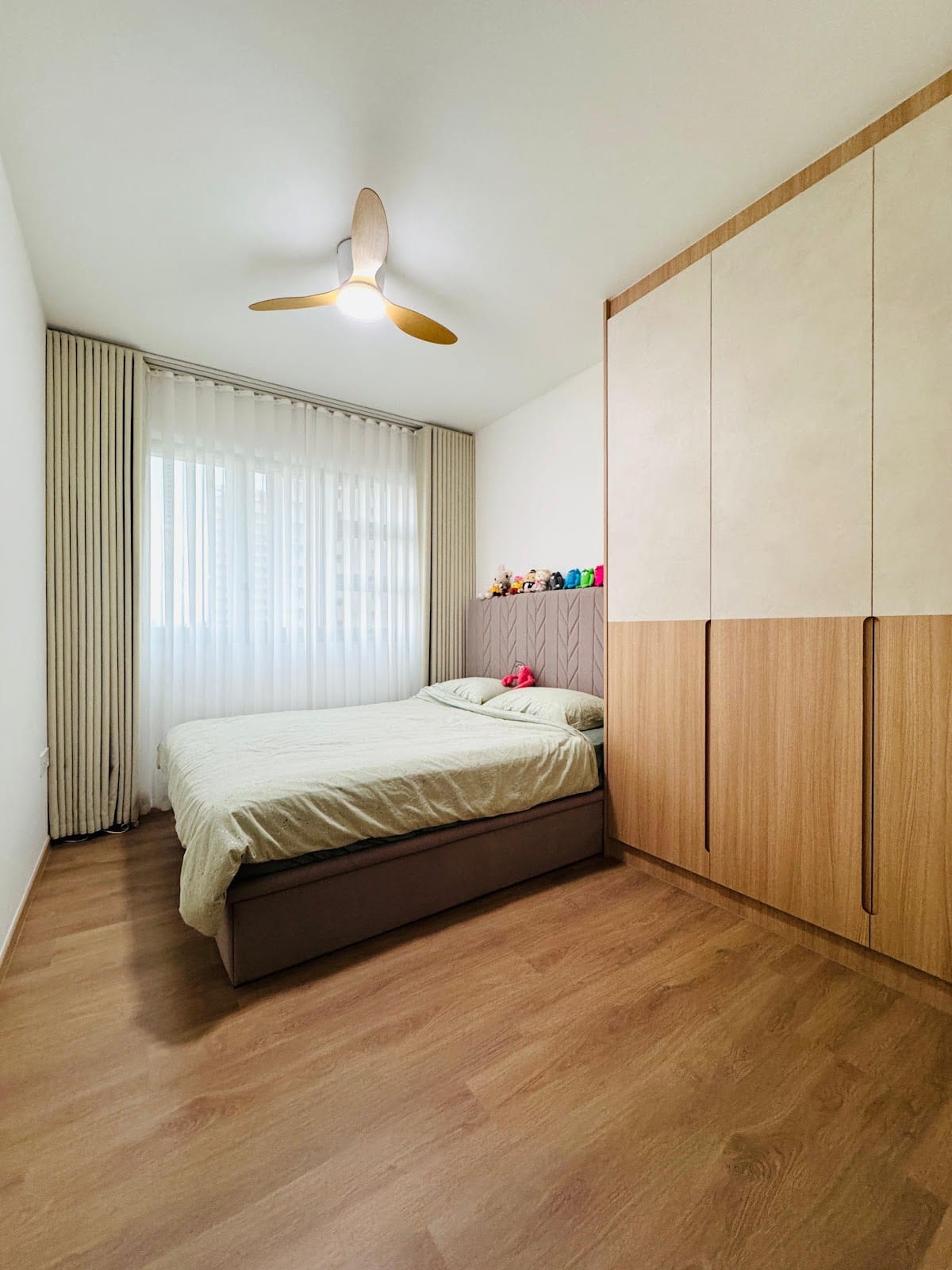 Living room custom carpentry and fluted feature wall at 138 Punggol Walk